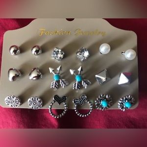 9 pair of silver tone earrings